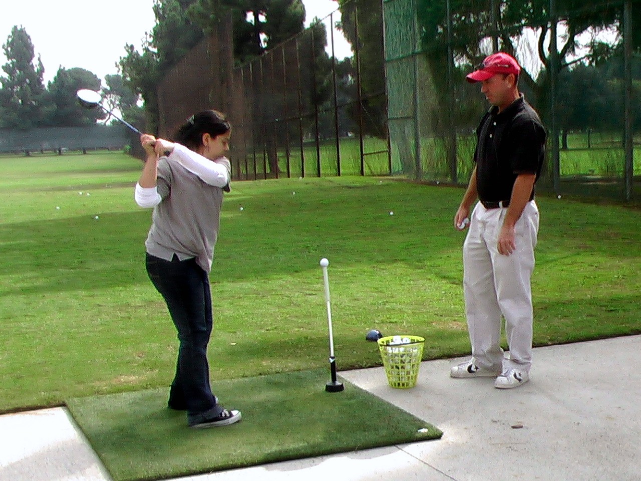 First time school girl golfer in East Los Angeles